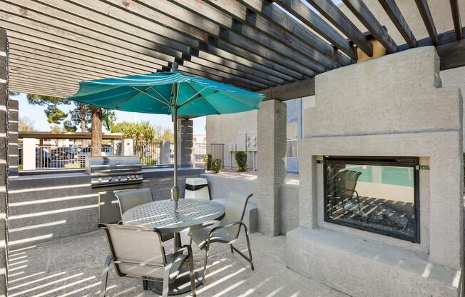 Outdoor Seating and Fireplace at Aztec Springs