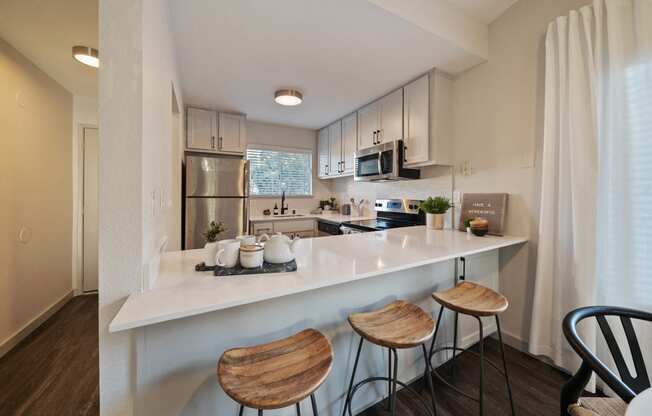 Kitchen with upgraded counter tops and stainless steel appliances at Bay Village, Vallejo, CA