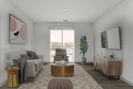 a living room with a couch and a chair in a 555 waverly unit at The Waterford At Rocketts Landing Apartments, PRG Real Estate, Richmond, Virginia