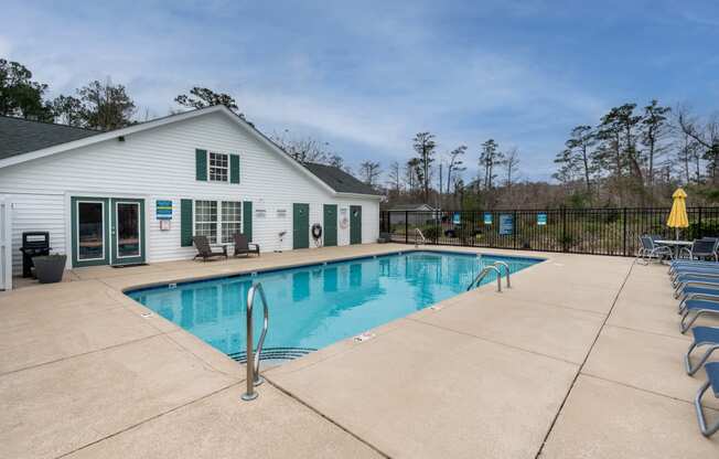 sparkling swimming pool and large pool deck
