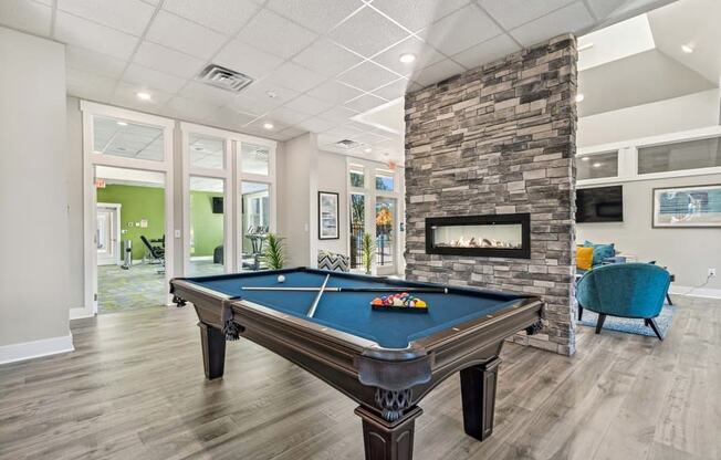 Community area with billiards table and fireplace