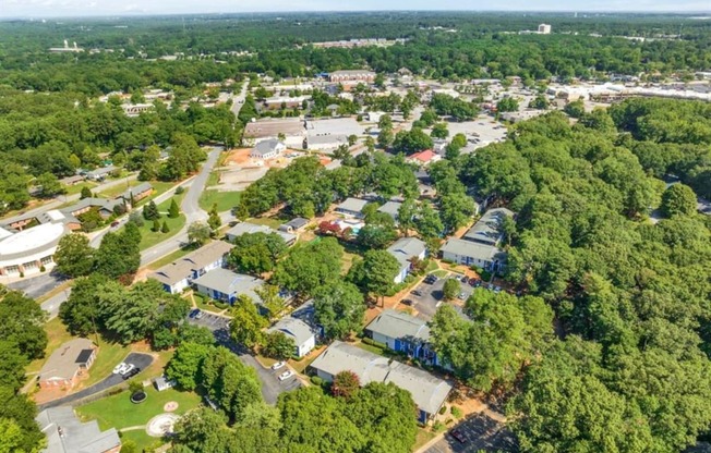 an aerial view of a neighborhood with houses and trees