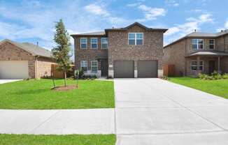 a house with a long driveway in front of it