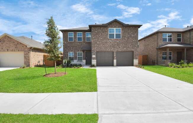 a house with a long driveway in front of it