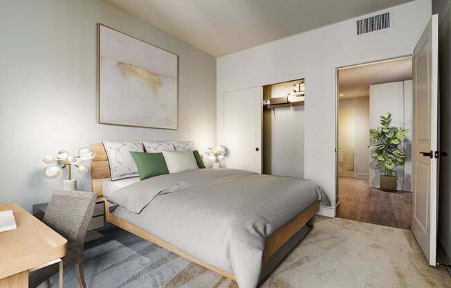 A bedroom with a bed, chair, and painting on the wall.