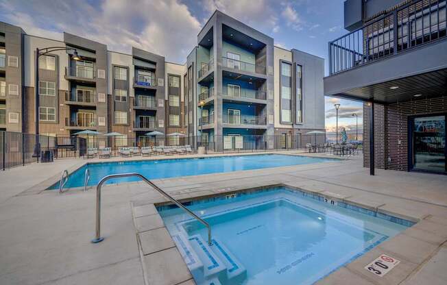 a swimming pool at an apartment building with a pool