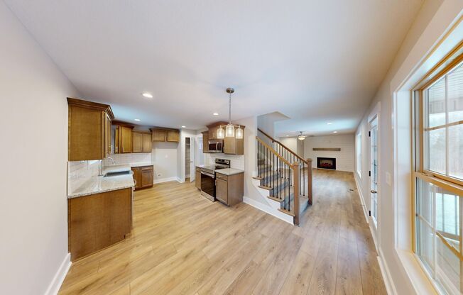 Beautifully Upgraded Home | Stone Fireplace, Open Kitchen and Two-Car Garage
