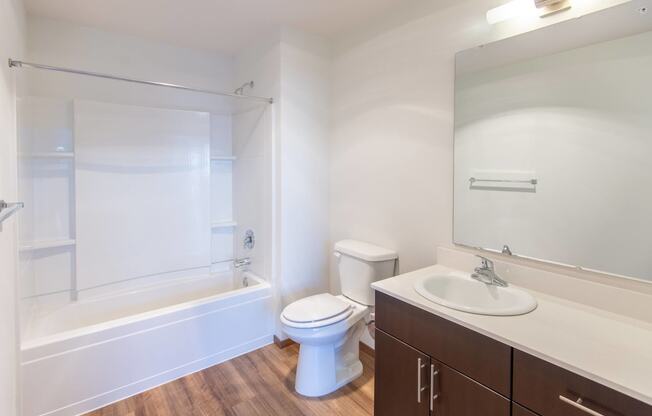 a bathroom with a sink toilet and a bath tub