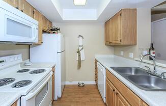 a kitchen with a white stove top oven