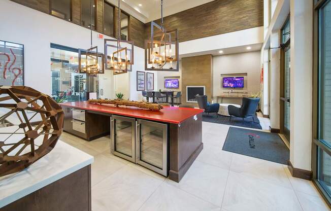 the lobby of a hotel with a red counter top