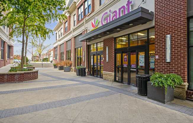 A brick building with a purple sign that says Giant.