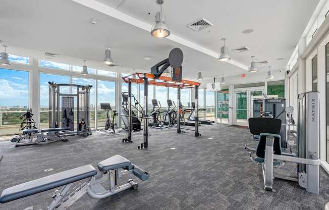 A gym with a variety of equipment including a leg press machine.