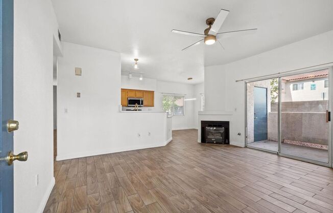 Charming 2-Bedroom First Floor Featuring Open Layout, Fireplace, Patio & Community Pool