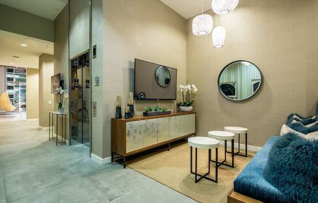 A modern bedroom with a large bed and a mirror on the wall.