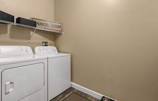 A laundry room with a washer and dryer.