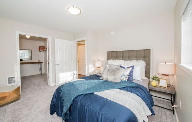 a bedroom with a bed and two night stands at The Arden Apartments, Gresham, 97080 