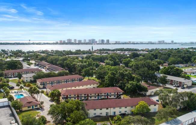 an aerial view of the campus with the water in the background