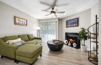 a living room with a couch and a chair and a fireplace at View at Lake Lynn, North Carolina