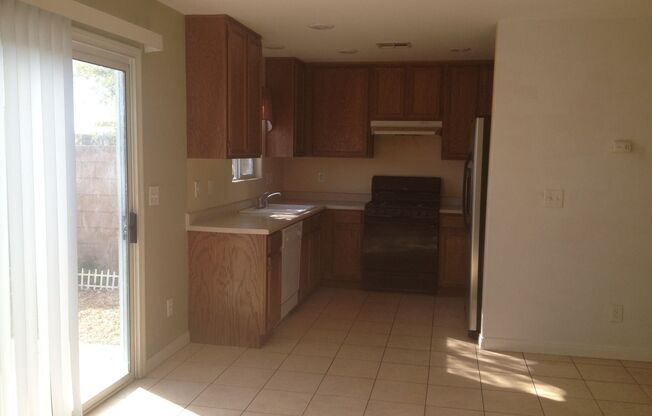 3 Bed/2.5 bath. All Tile Downstairs. Open Great Room floor plan.