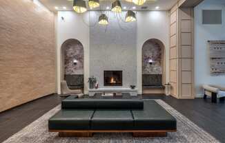 a living room with a fireplace and a couch