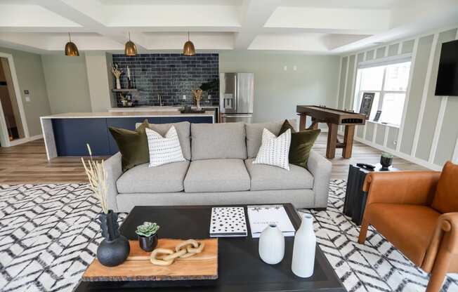 a living room filled with furniture and a large window