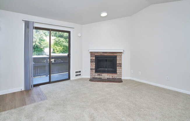 Carpeted Living Room with Fireplace and Balcony