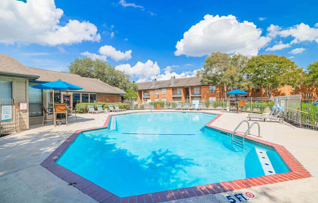 A large swimming pool with a red and blue border.
