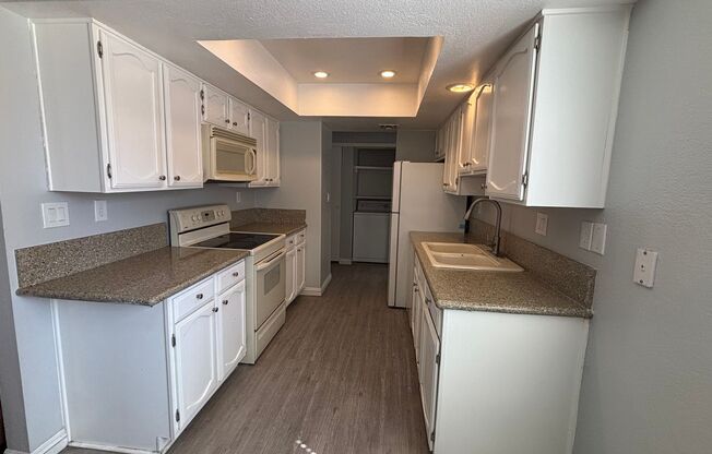 Partially furnished Cozy second-floor condo in a gated Southwest community 2 bedrms+2baths