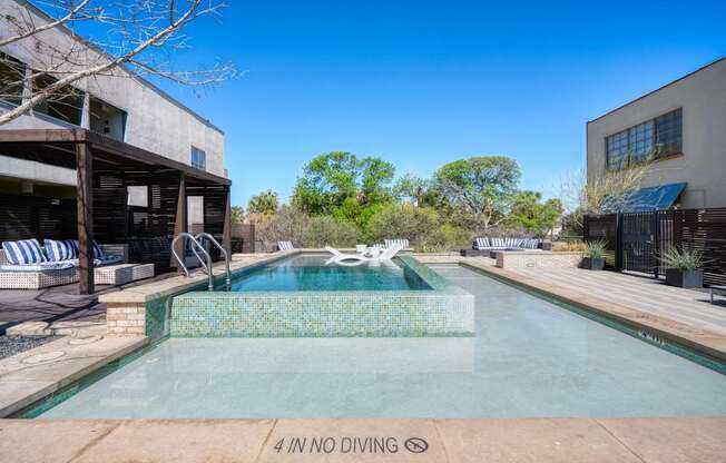 A pool with a 4 in no diving sign.