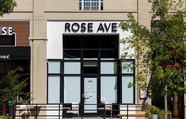 the front of rose ave in front of a building