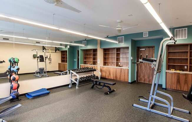 Fitness Center with Free Weights, Bench and leg lift bar.