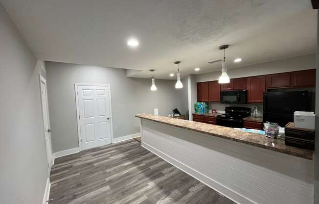 A white door is in a room with a counter.