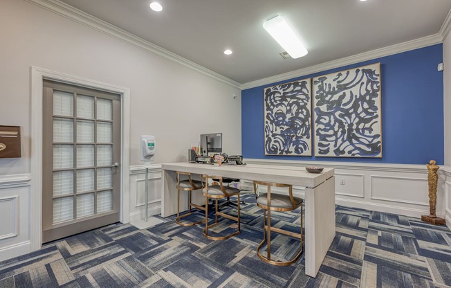 A room with a table and chairs in it.