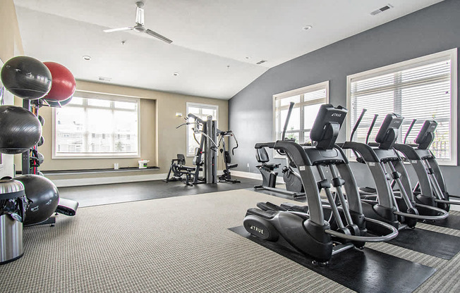 Cardio machines in fitness center at Strathmore Apartment Homes, Iowa