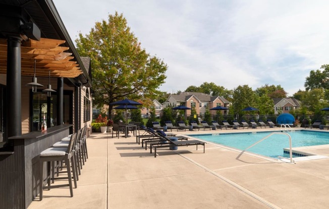 Pool seating and pergola bar