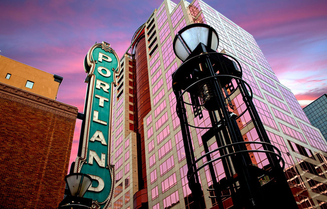 a street light in front of a tall building