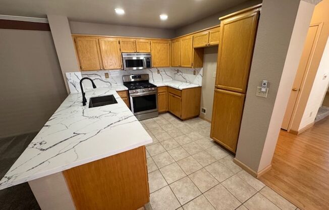 Gorgeous updated gated community unit!