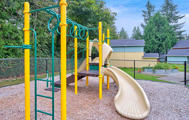 our playground is equipped with a swing set and slides at Woodcreek, Washington
