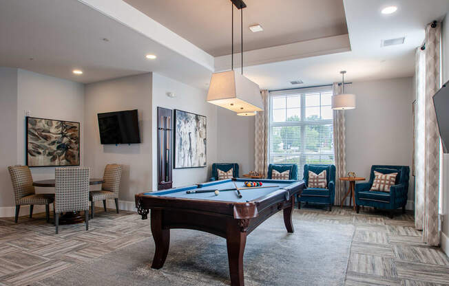 the reserve at bucklin hill leasing office game room with pool table and flat screen tv