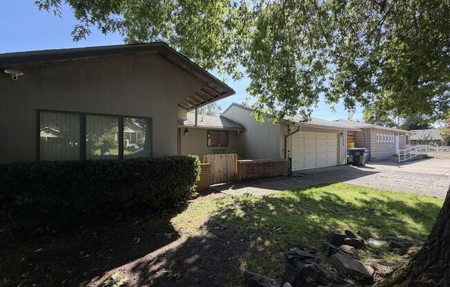 Spacious 3 Bedroom Home with Multiple Living Areas, Two Fireplaces, Hardwood Floors & Outdoor Patio