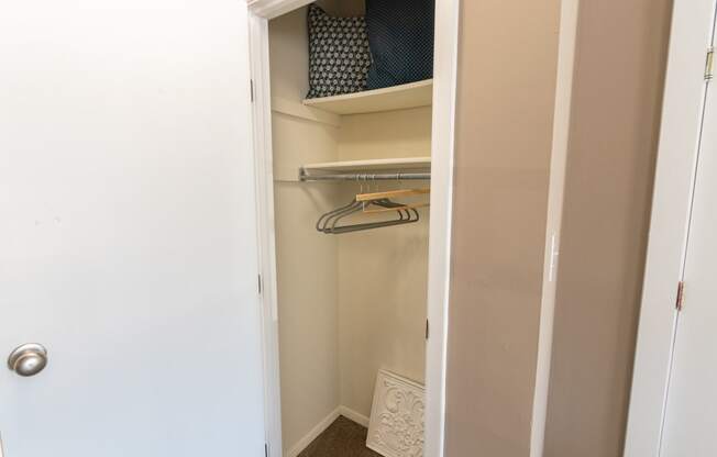 This is a photo of the living room closet in the upgraded 650 square foot, 1 bedroom model apartment at Deer Hill Apartments in Cincinnati, Ohio.