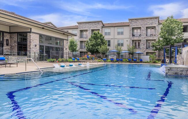 a large pool of water in front of a building