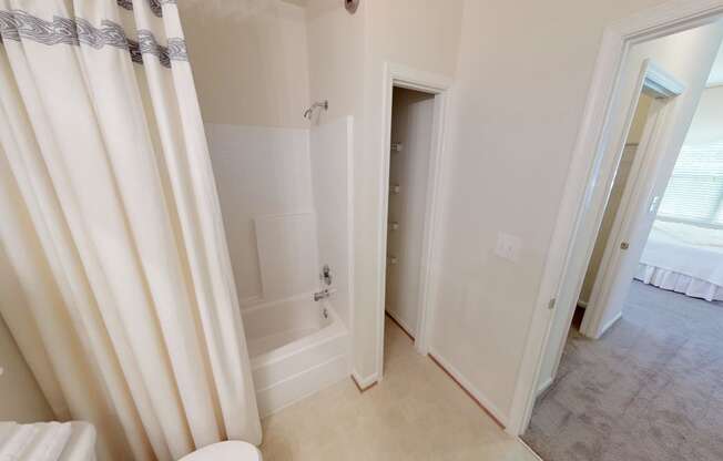 Bathroom with sink, toilet, shower and tub; linen closet