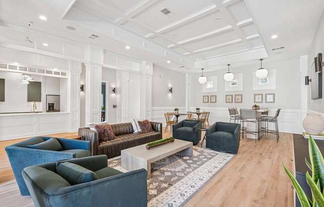 A living room with a white ceiling and a rug on the floor.