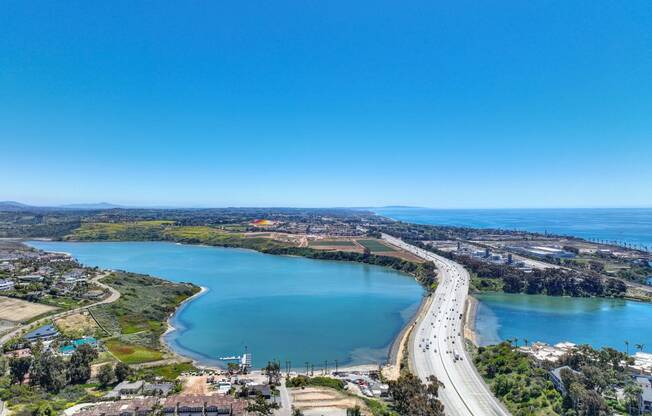 a bridge over a body of water next to a highway