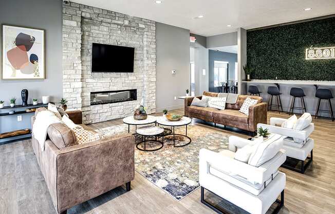 a living room with couches and chairs and a fireplace