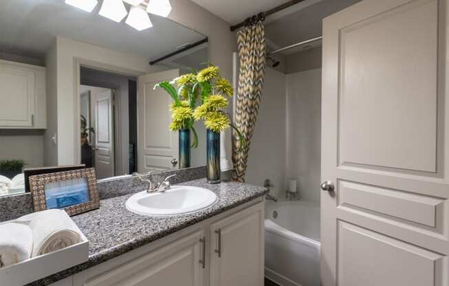 This is a photo of the bathroom of the 826 square foot 1 bedroom apartment at The Brownstones Townhome Apartments in Dallas, TX.