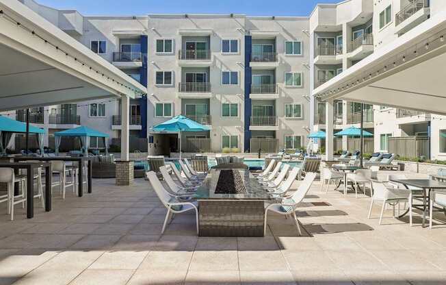 A sunny day at the poolside of a residential building.