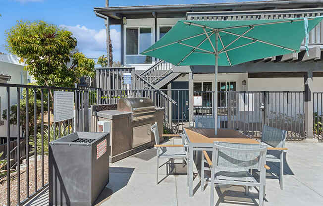 Outdoor BBQ Area with Furniture at Colonnade at Fletcher Hills Apartments in El Cajon, CA.