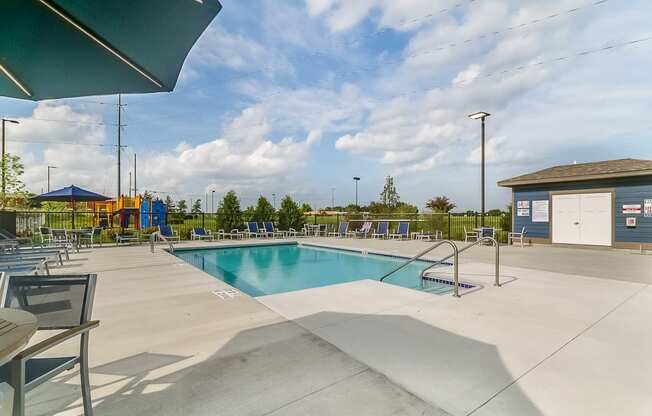 the pool at the whispering winds apartments in pearland, tx